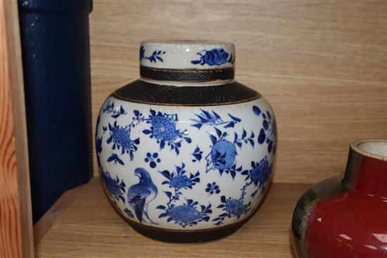 A Chinese squat baluster vase, crackle-glazed in green and red, a blue and white ginger jar and cover and a redware teapot